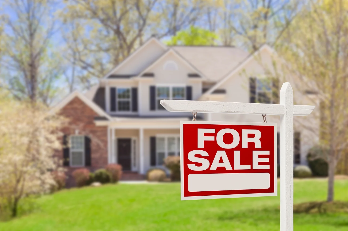 House with a For Sale sign.