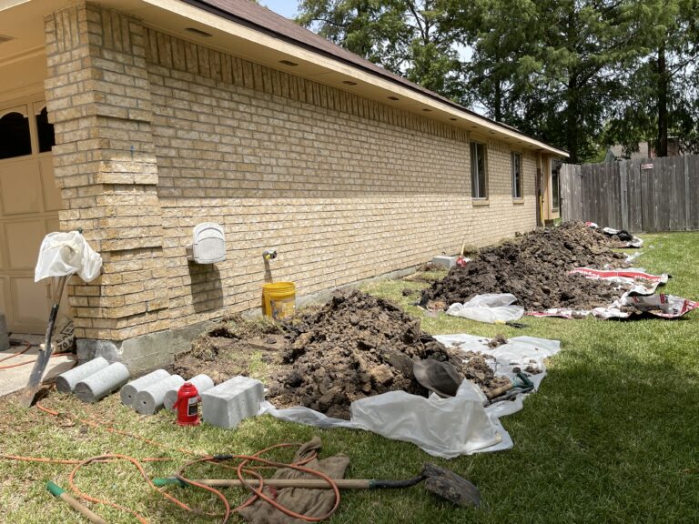 Piers being installed under a home by Continental Foundation Restoration in Houston TX