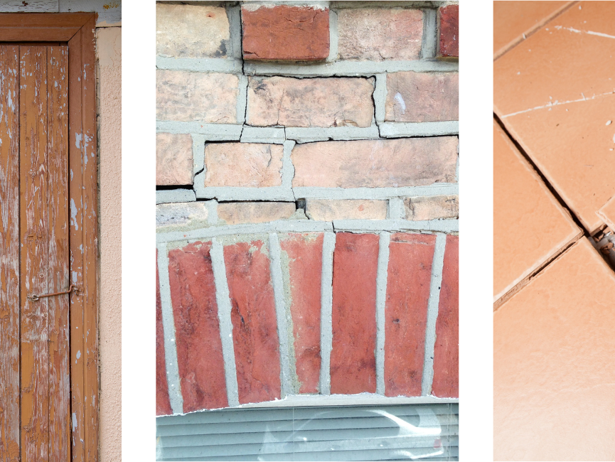 Cracked bricks on the side of a home.