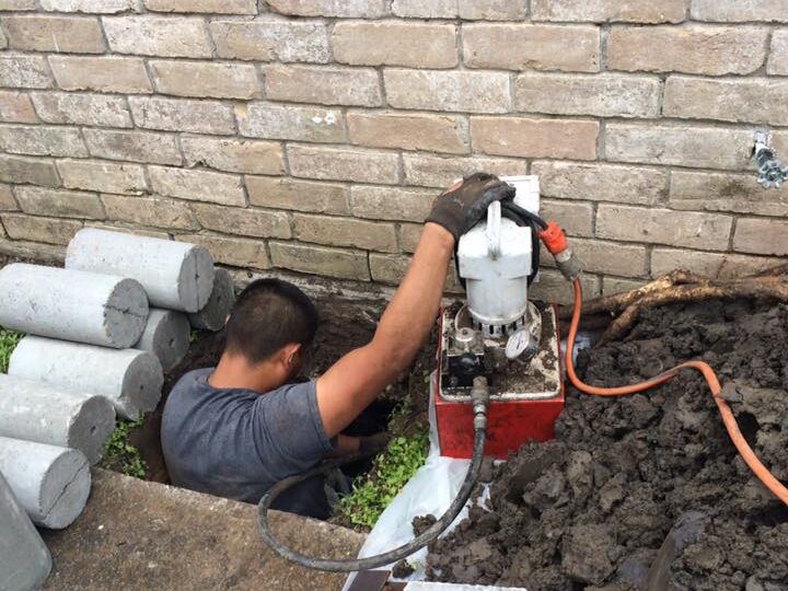 A worker of Continental Foundation Restoration working on foundation repair.
